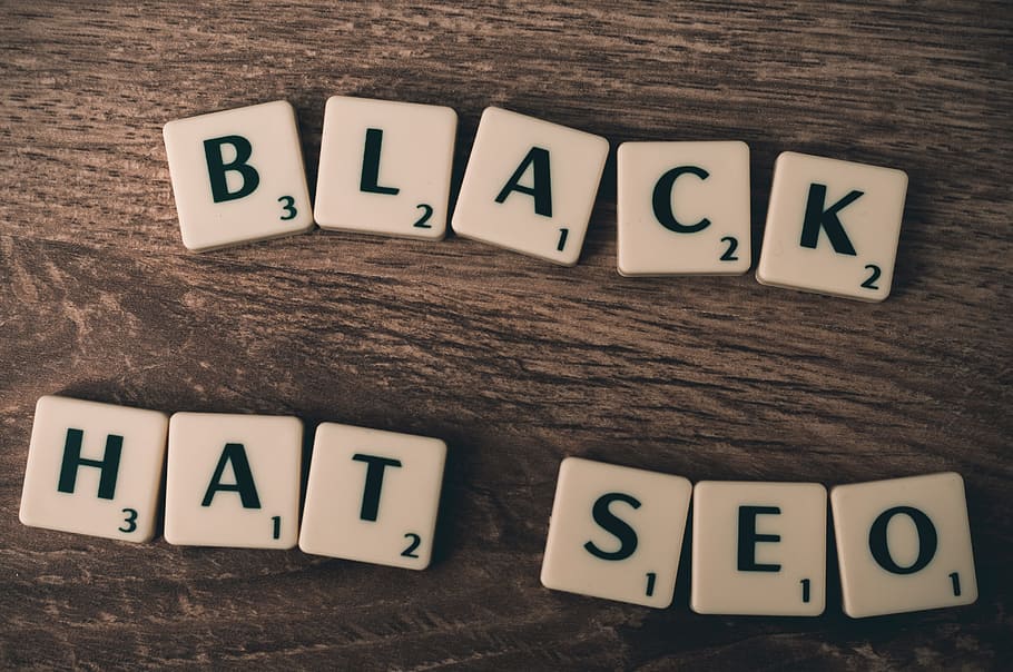 Black Hat SEO spelled out with Scrabble letters